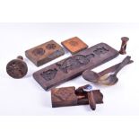 A quantity of antique treen kitchenalia to include three oak shortbread or butter moulds, two pastry