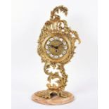 A Louis XV style gilt brass cartel clock on stand designed with pierced and scrolled acanthus leaf