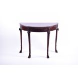 An Adams style mahogany demi lune card table with rope twist edge above a reeded frieze and