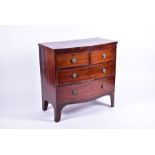 A 19th century flame mahogany bow-front chest of drawers with two short over two long drawers,