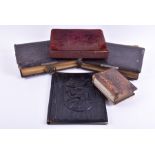 A group of Victorian leather bound photo albums including one velvet bound, together with a carved