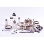 A small collection of silver mounted cut glass cruet bottles together with Mexican silver mustard