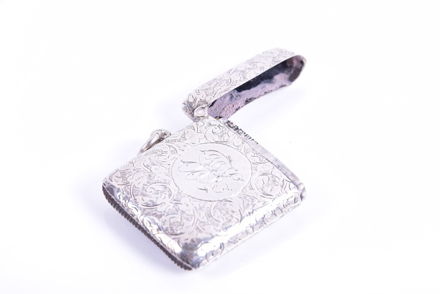 Two silver vesta cases and a miniature pill box the larger vesta decorated with crawling floral work - Image 2 of 7