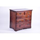 An early 19th century oak chest  with two short over three long drawers, brass handles, 87 cm wide x