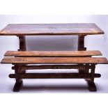 An 18th century and later oak refectory table, made of three planks on two solid end supports with