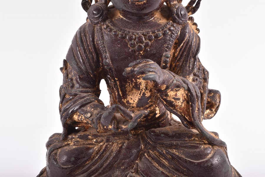 A 19th century or earlier Tibetan gilt bronze sculpture of Padmasambhava modelled seated in - Image 5 of 10