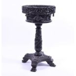 A 19th century Anglo-Indian carved hardwood jardinière stand the heavy top profusely and ornately