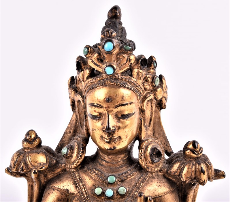 A fine Tibetan gilt metal figure of Tara, 15th/16th century, cast seated in lalitasana on a double - Image 2 of 8