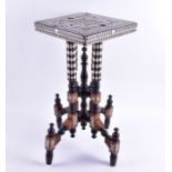 A turn of the century Moroccan inlaid table with camel bone and ebony inlay, the square top is