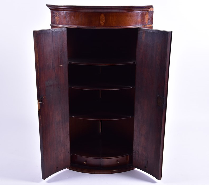 An Edwardian bow-fronted wall-hanging corner cupboard with double hinged central doors and - Image 5 of 5