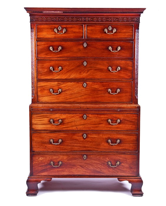 A fine George III mahogany chest on chest with stylised Greek key decoration and carved frieze