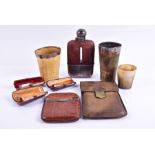 A group of three amber mounted cheroot holders to include two gold capped cheroot holders, with