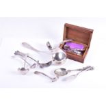 A collection of 19th century and later Dutch silver spoons to include a ladle, sauce, coffee and a