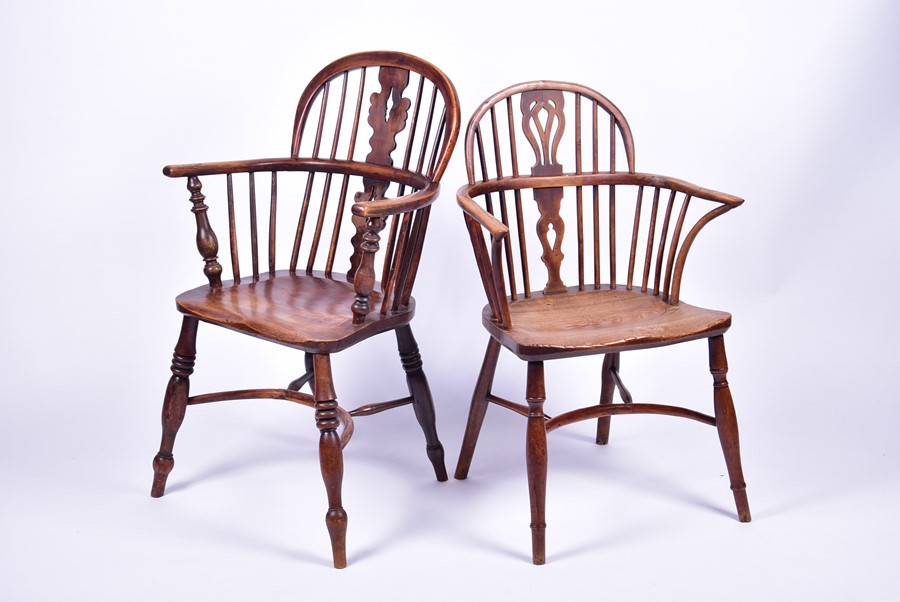 Two graduated 19th century elm and ash Windsor armchairs each with pierced vase splatbacks and