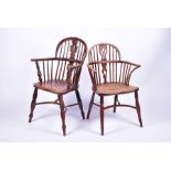 Two graduated 19th century elm and ash Windsor armchairs each with pierced vase splatbacks and
