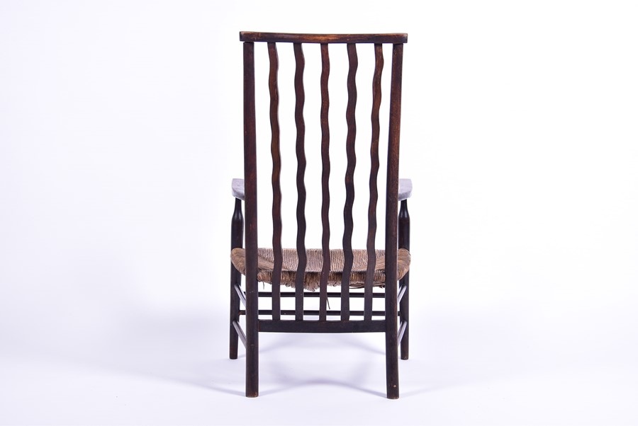 A 19th century rush seated low carver chair in the Arts and Crafts style, the seat 30 cm high. - Image 4 of 4