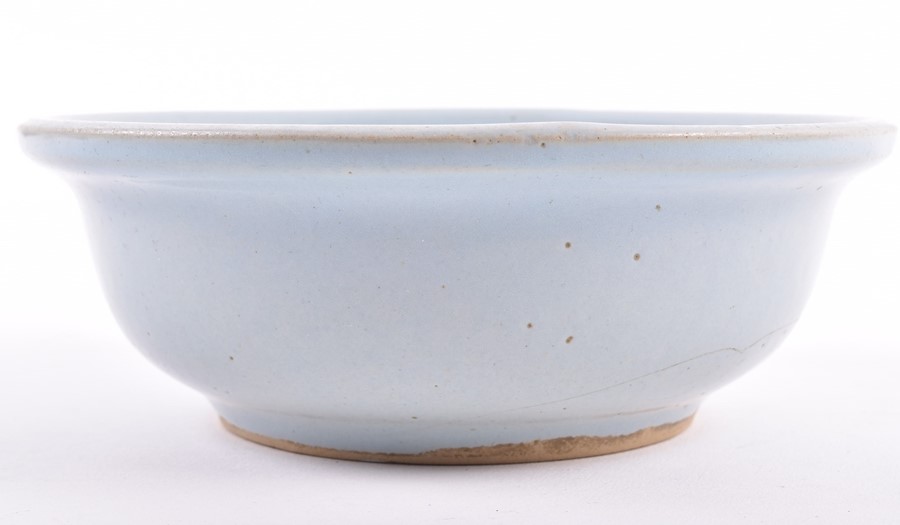 A Chinese powder blue bowl possibly Song dynasty, of even powder blue colour, with some pitting to - Image 2 of 5