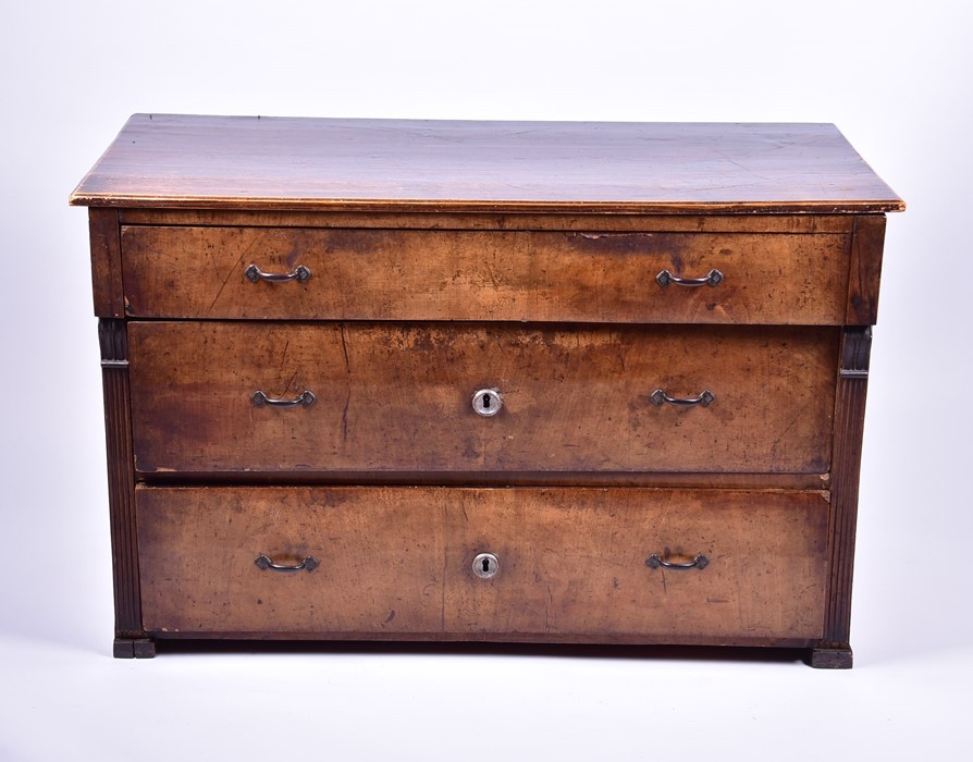 A late 18th or early 19th century walnut veneered chest with,  three graduated drawers flanked by