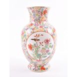 A 19th century or earlier Chinese Canton enamel famille rose vase the body finely decorated with