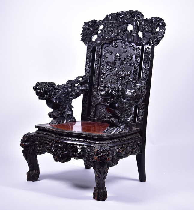 A large and impressive late 19th / early 20th century Chinese carved hardwood throne chair the