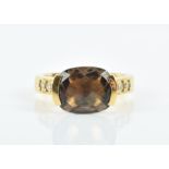 An 18ct yellow gold, diamond, and smokey quartz ring set with a faceted rectangular cushion-cut
