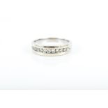 A diamond ring channel-set with nine round brilliant-cut diamonds weighing approximately 0.50 carats