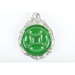 A Chinese jadeite jade and diamond pendant set in white gold marked 750 (tested), 36 mm wide, 17.3