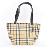 Burberry. A vintage checked design handbag approximately 36 cm wide, in original dustbag.