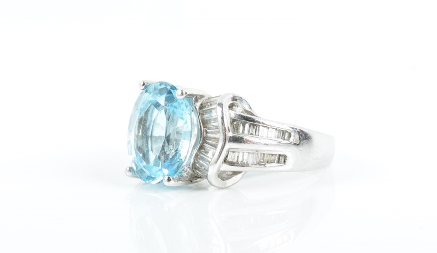 An 18ct white gold, diamond, and blue topaz ring set with an oval-cut topaz of approximately 4.0 - Image 3 of 3