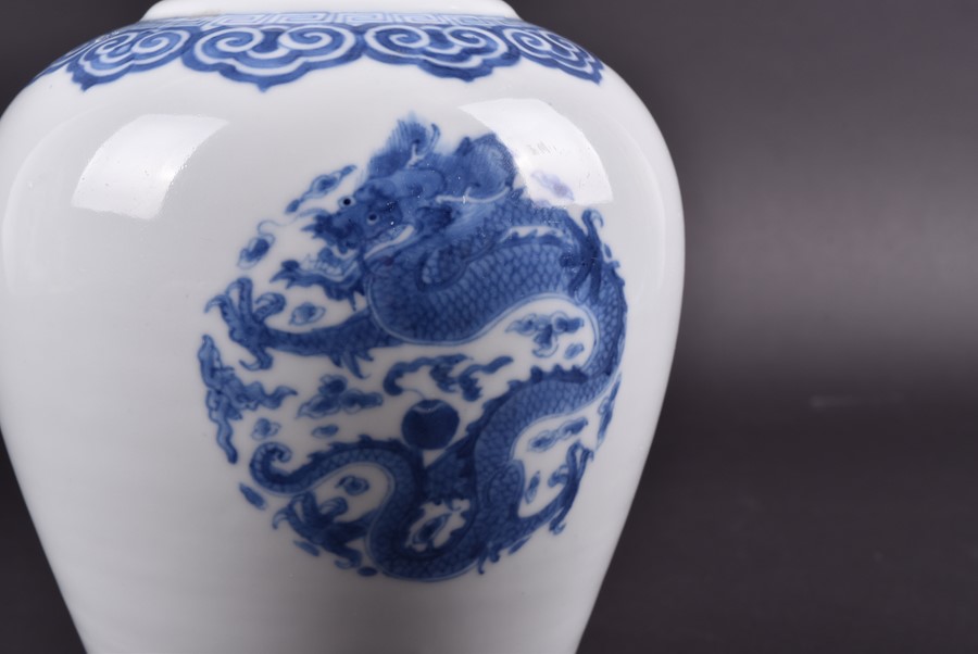 A Chinese Kangxi period blue and white baluster jar the body decorated with three roundels depicting - Image 4 of 7