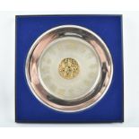 A Queens Silver Jubilee 1952-1977 silver plate with gilded central panel and engraved crests of