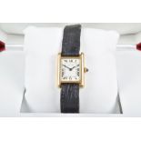 A Cartier Tank 18ct yellow gold ladies wristwatch the rectangular white dial with black Roman