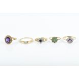 A group of 9ct yellow gold rings including an emerald cluster ring, size M, an amethyst ring, size