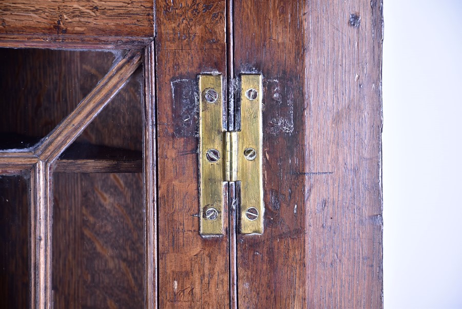 A Georgian oak corner display cabinet with moulded dentil pediment above a glazed door with - Image 3 of 5