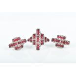Zancan, Italy. An 18ct white gold, diamond, and ruby ring of geometric design, the diamond set