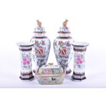A collection of decorative Asian vases to include two urns with armorial crest, two similarly