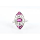 A diamond and ruby ring in the Art Deco taste, the navette-shaped mount centred with an oval-cut