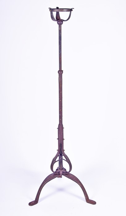 A late 19th century wrought iron telescopic Arts and Crafts lamp standard with applied metal