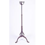 A late 19th century wrought iron telescopic Arts and Crafts lamp standard with applied metal