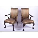 A pair of George II style antique 'Gainsborough' armchairs possibly reproduction, each with