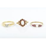 An 18ct yellow gold and solitaire diamond ring size K, together with a 9ct yellow gold, ruby and