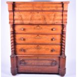 A Victorian Scottish flame mahogany chest with two slide over four graduated drawers, flanked by