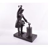 A turn of the century Russian bronze figure of a blacksmith, purported to be Alexander the Great