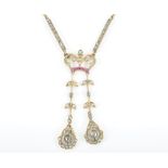 A late 19th / early 20th century yellow gold, diamond, and ruby drop pendant necklace the pendant