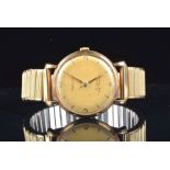 A Rotary 9ct yellow gold automatic wristwatch the gilt dial with baton hour markers and numerals,