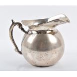 A Peruvian white metal water jug by Welsch & Co marked " Welsch Plata 900" indicating 900 standard