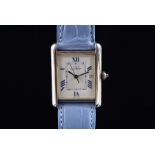 A Must de Cartier Tank silver ladies wristwatch the rectangular white dial with blue Roman numerals,