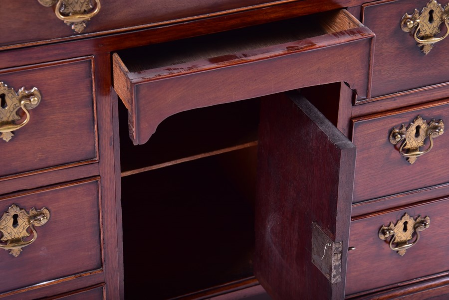 A George II mahogany knee hole desk of small proportions the rectangular top above an arrangement of - Image 3 of 6