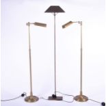 A pair of modern adjustable brass reading lamps 95 cm high when closed, 134 cm when extended;