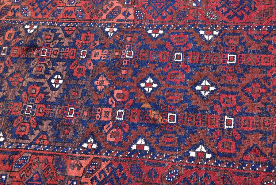 A late 19th/early 20th century Caucasian rug probably Daghestan in style, designed with madder red - Image 3 of 4